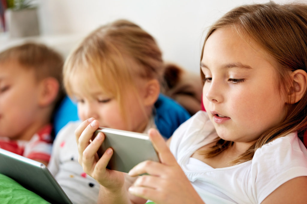 kids playing on smart devices